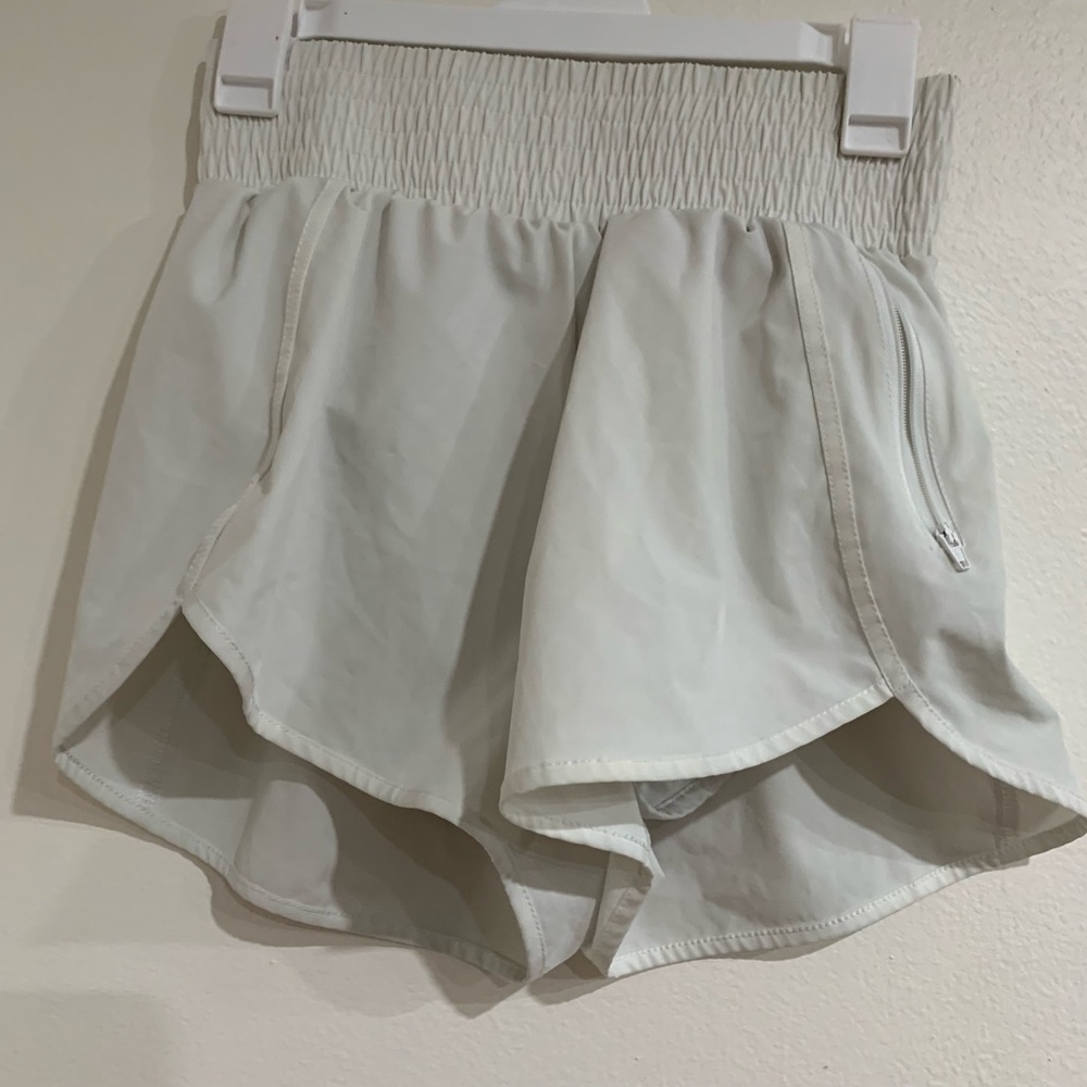 Running/workout shorts attached legging shorts. Zipper pocket Women’s Size Small